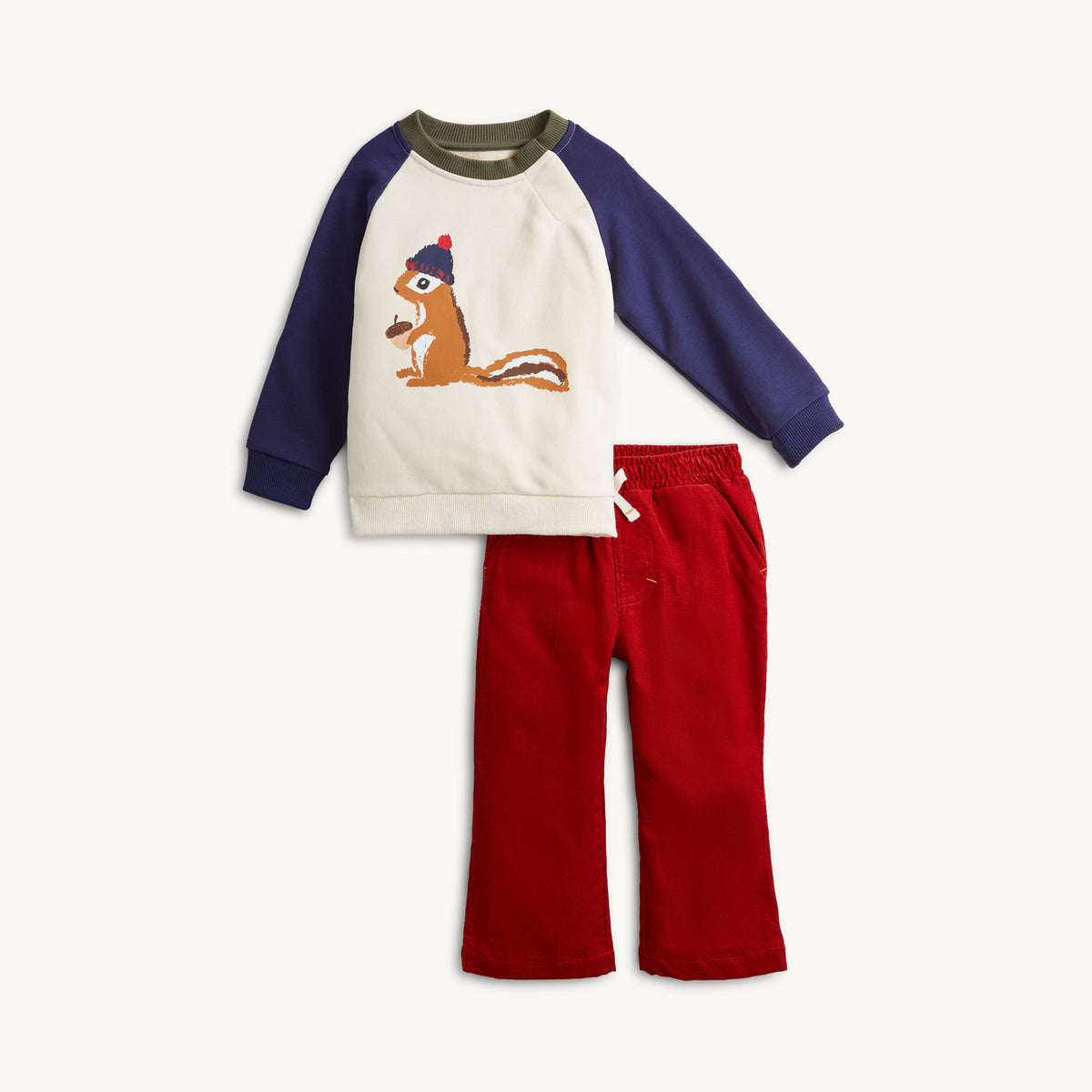 A toddler's two-piece knit outfit set featuring a cream and navy raglan sweatshirt with a chipmunk graphic, paired with red pants, shown on a light off-white background.