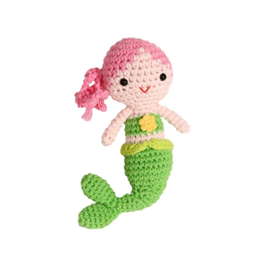 Crocheted mermaid rattle with pink hair and green tail on a white background