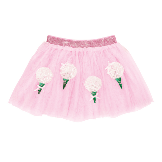 Pink tutu skirt with sequins shaped like white golf balls on a green golf tee