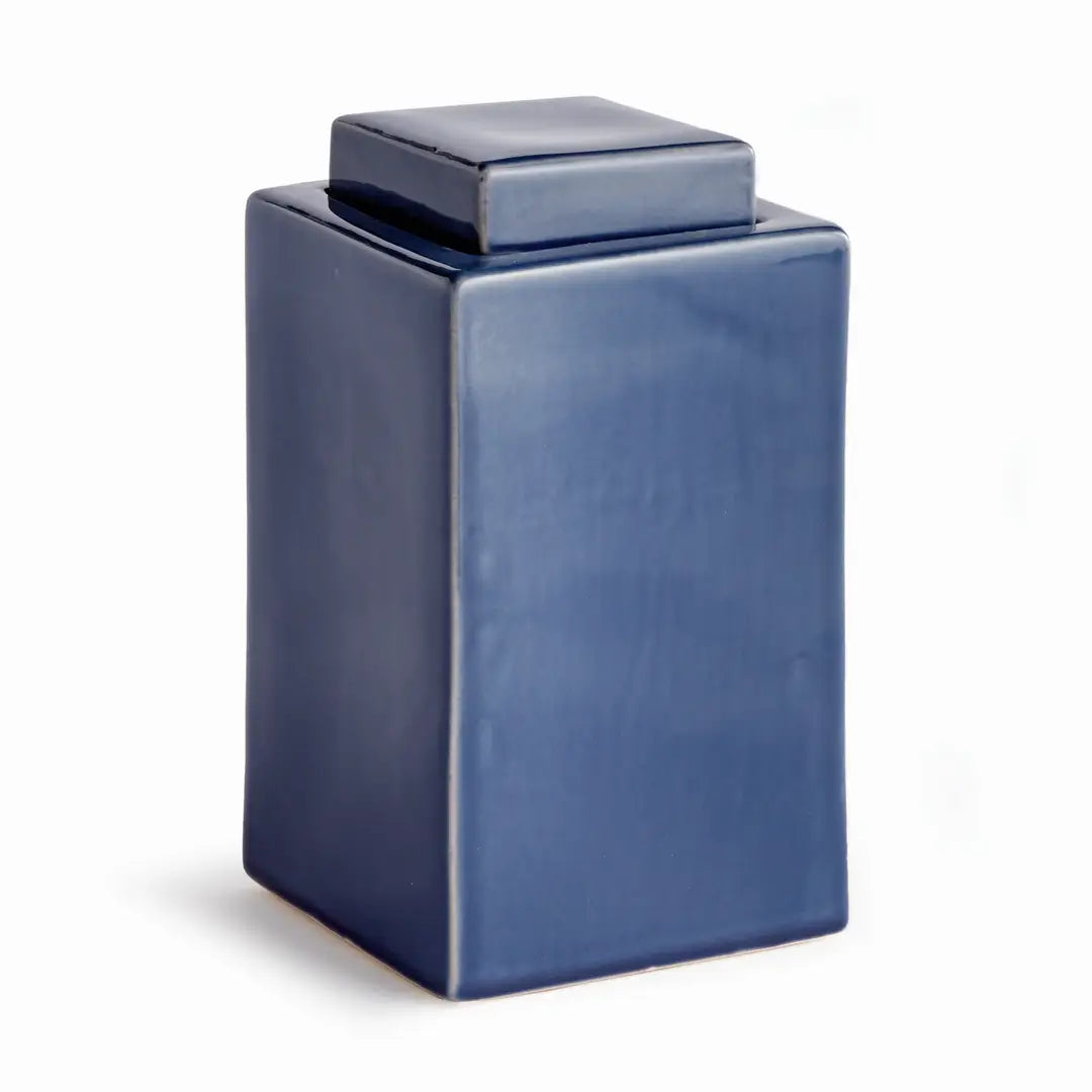 A glossy dark blue rectangular ceramic canister with a matching lid, shown on a plain white background.