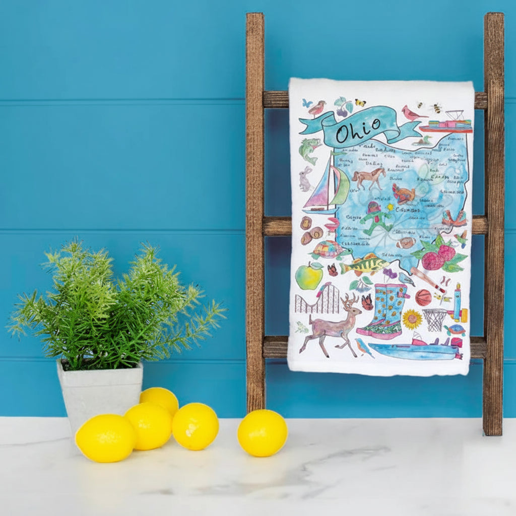 Decorative tea towel with Ohio map design showing cities and landmarks