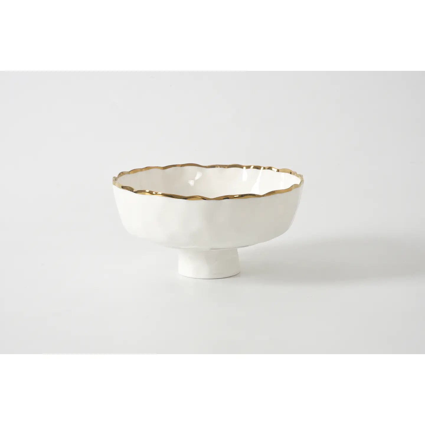 White ceramic footed bowl with gold rim by Pampa Bay