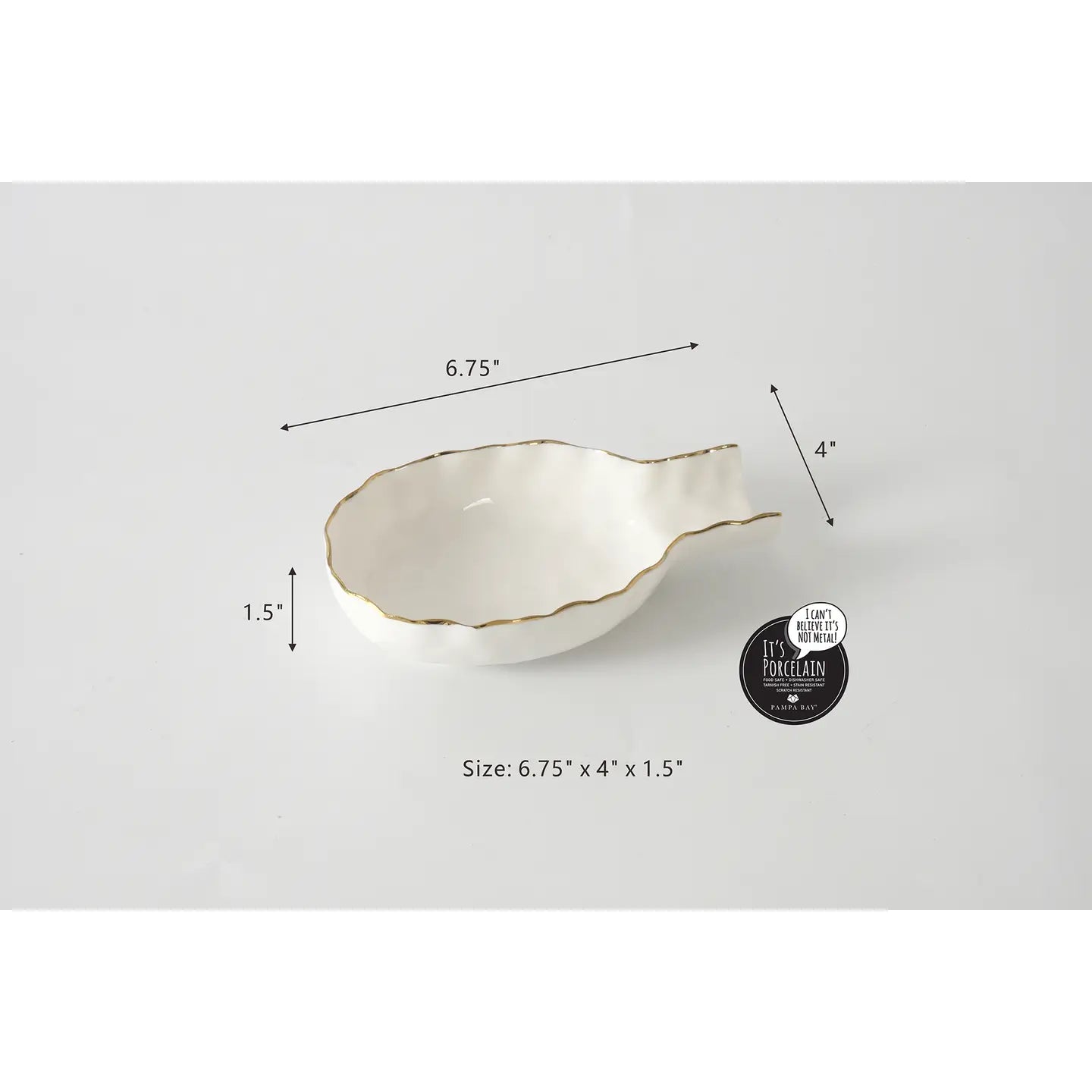 White ceramic spoon rest with gold rim and measurements 