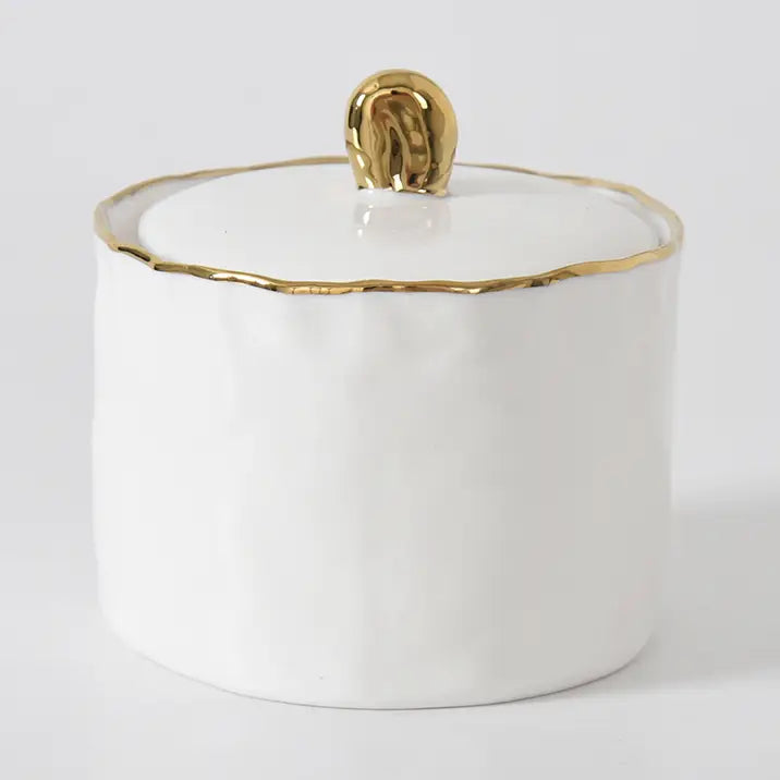 White ceramic sugar bowl with a gold rim and lid with gold handle by Pampa Bay