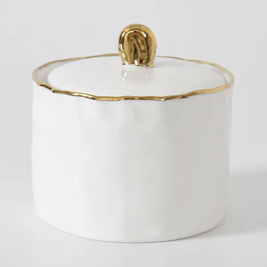 White ceramic sugar bowl with a gold rim and lid with gold handle by Pampa Bay