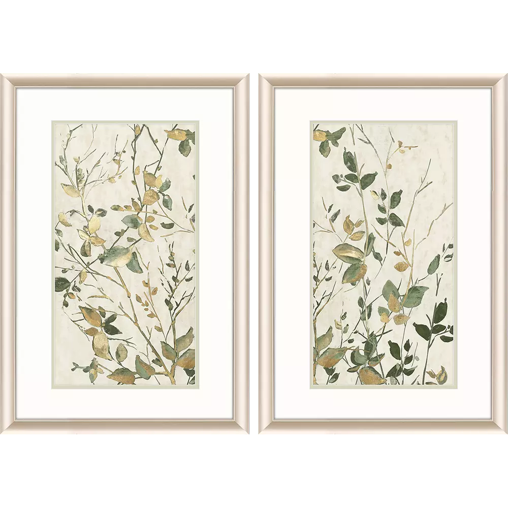 Two framed botanical prints with green and gold leaves on a beige background