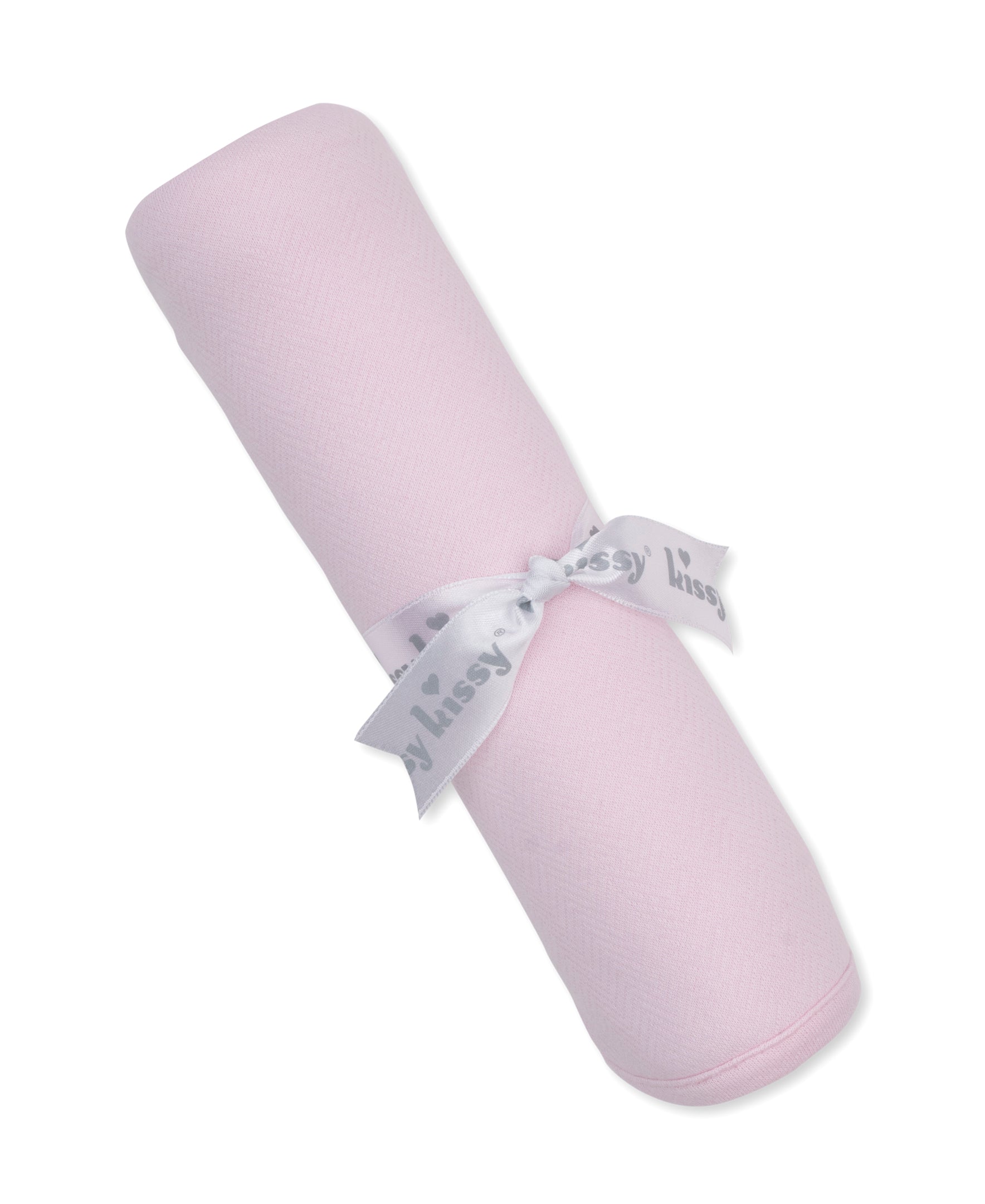 pink jacquard baby blanket rolled and tied with a kissy kissy ribbon
