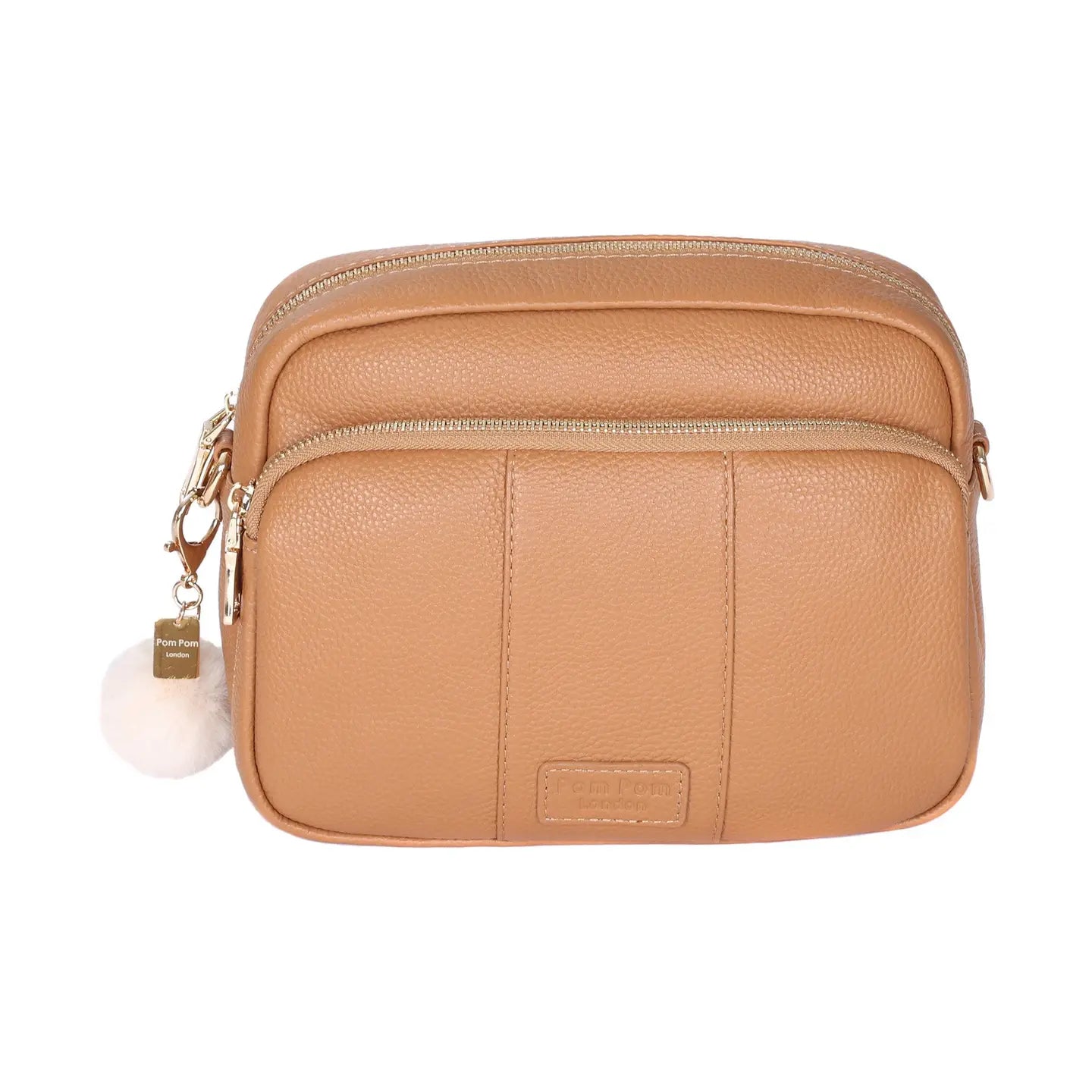pom pom london original bag in a maple color with a pom pom tassel  