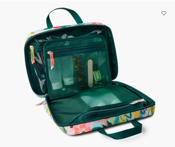 Floral-patterned travel bag with open compartments on a white background