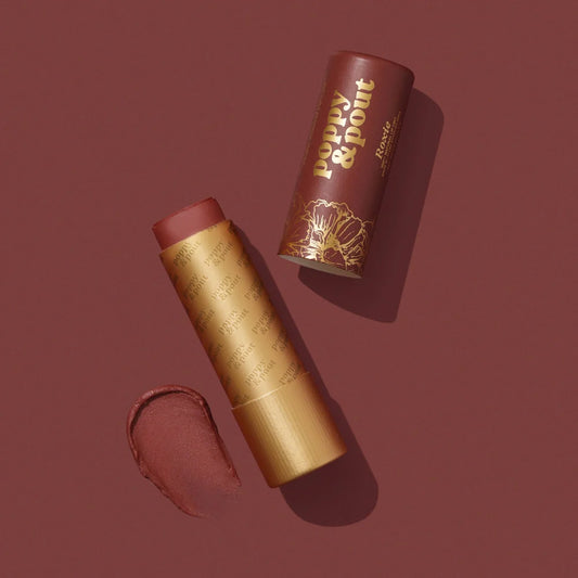 Lip tint with gold casing and brown shade on a matching background, featuring the brand 'Poppy & Point'.