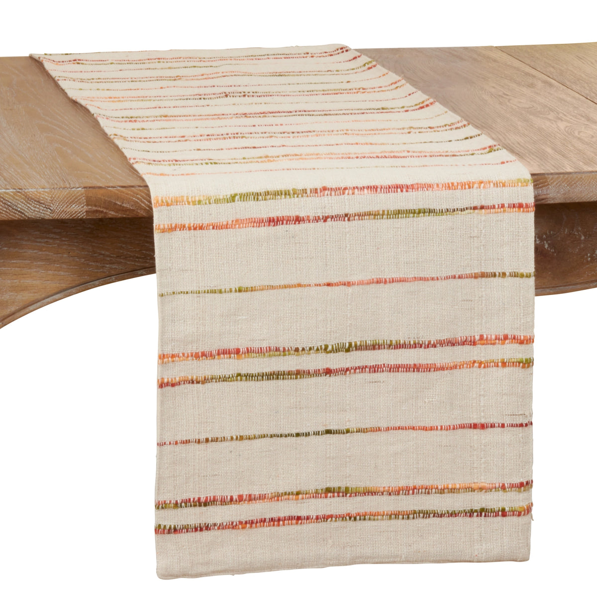 Striped table runner with stripes in shades of green and orange on a beige fabric.
