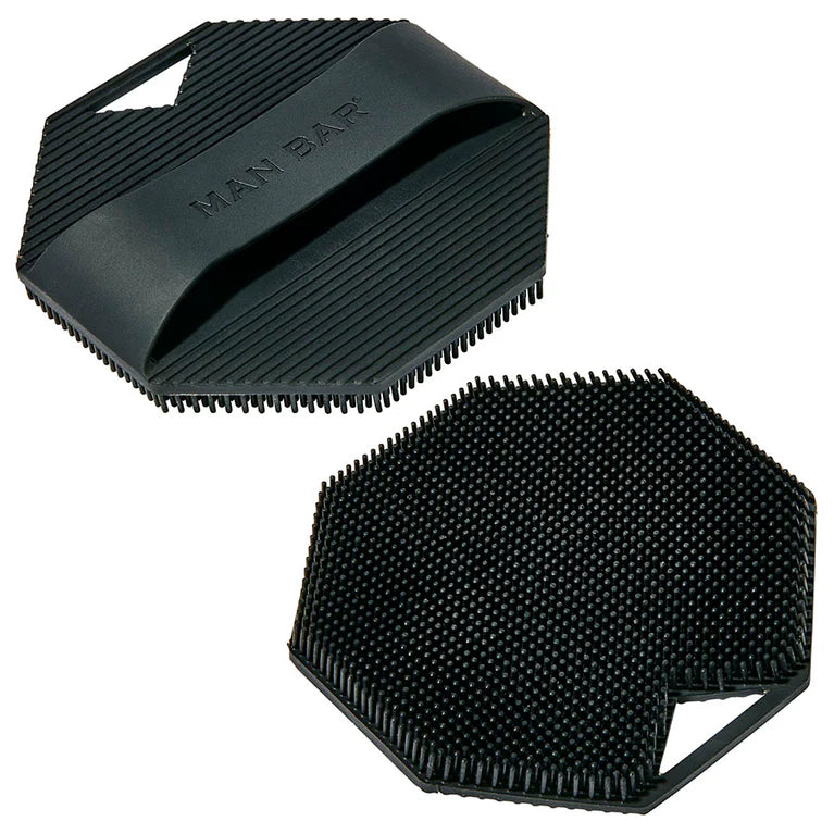 Two black Man bar grooming tools with textured surfaces on a white background