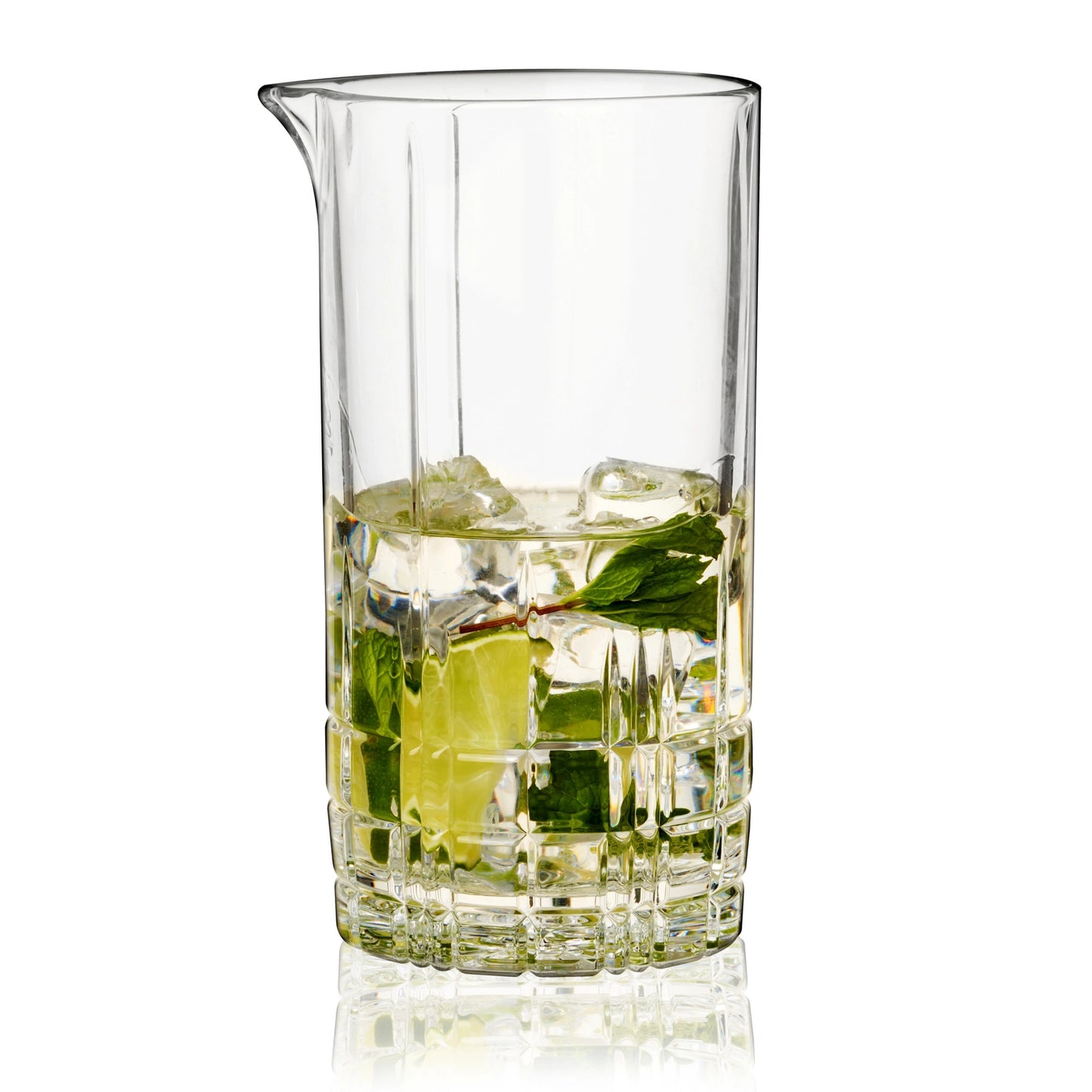 Clear glass spiegealu mixing picture with ice cubes and a green leaf on a white background