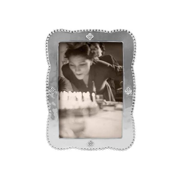 pearled, wavy edge silver photo frame 4 embellishments of 4 dots on each side 