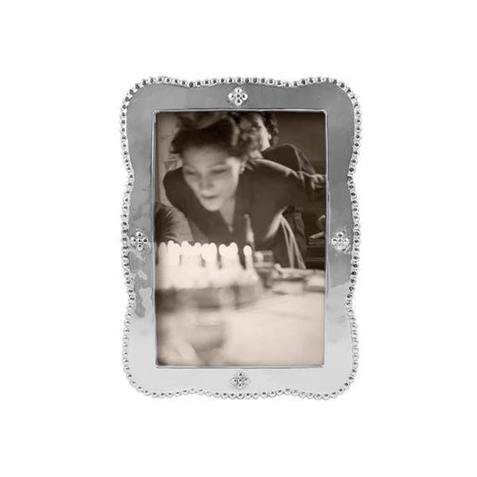pearled, wavy edge silver photo frame 4 embellishments of 4 dots on each side 