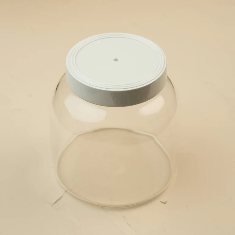 nora fleming Clear glass canister with a white melamine lid 