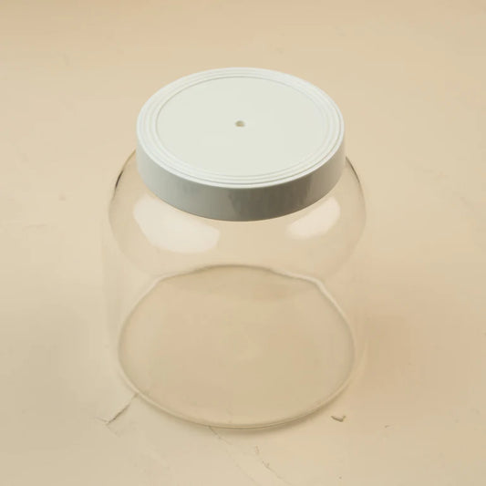 nora fleming Clear glass canister with a white melamine lid 