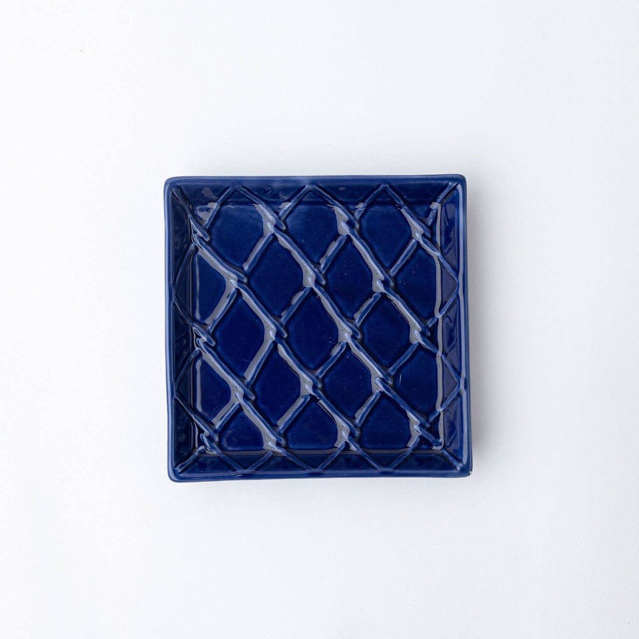 Navy blue square beverage napkin tray with lattice pattern