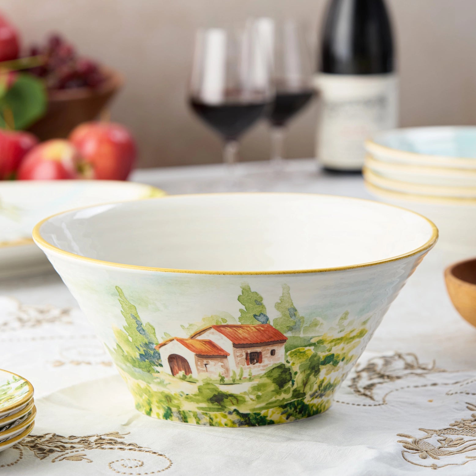 Decorative deep ceramic bowl with a Tuscan landscape design.