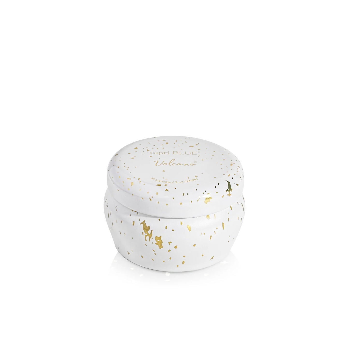 White mini tin candle with gold speckles and 'Volcano' branding on a white background