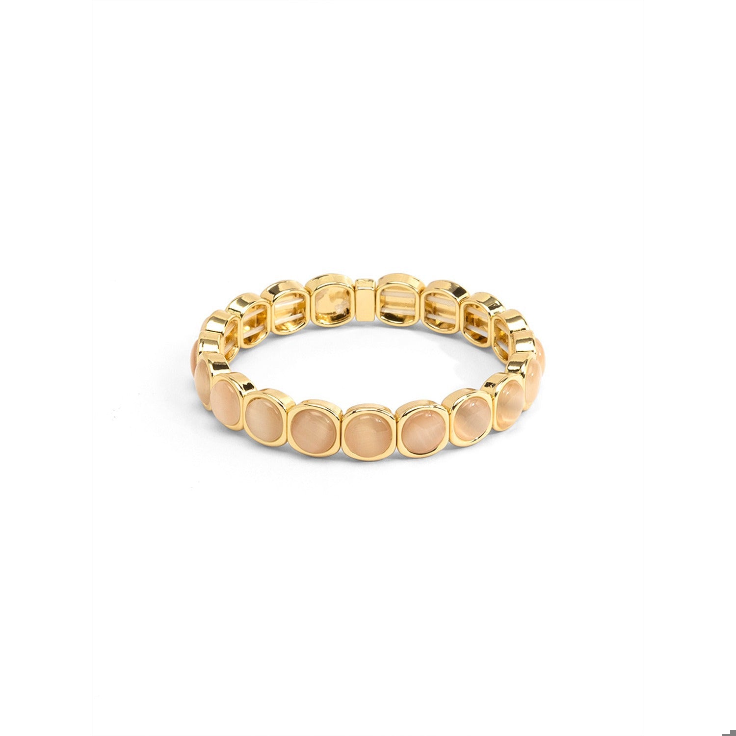 A gold-plated stretch bracelet featuring oval pale peach-beige stones.
