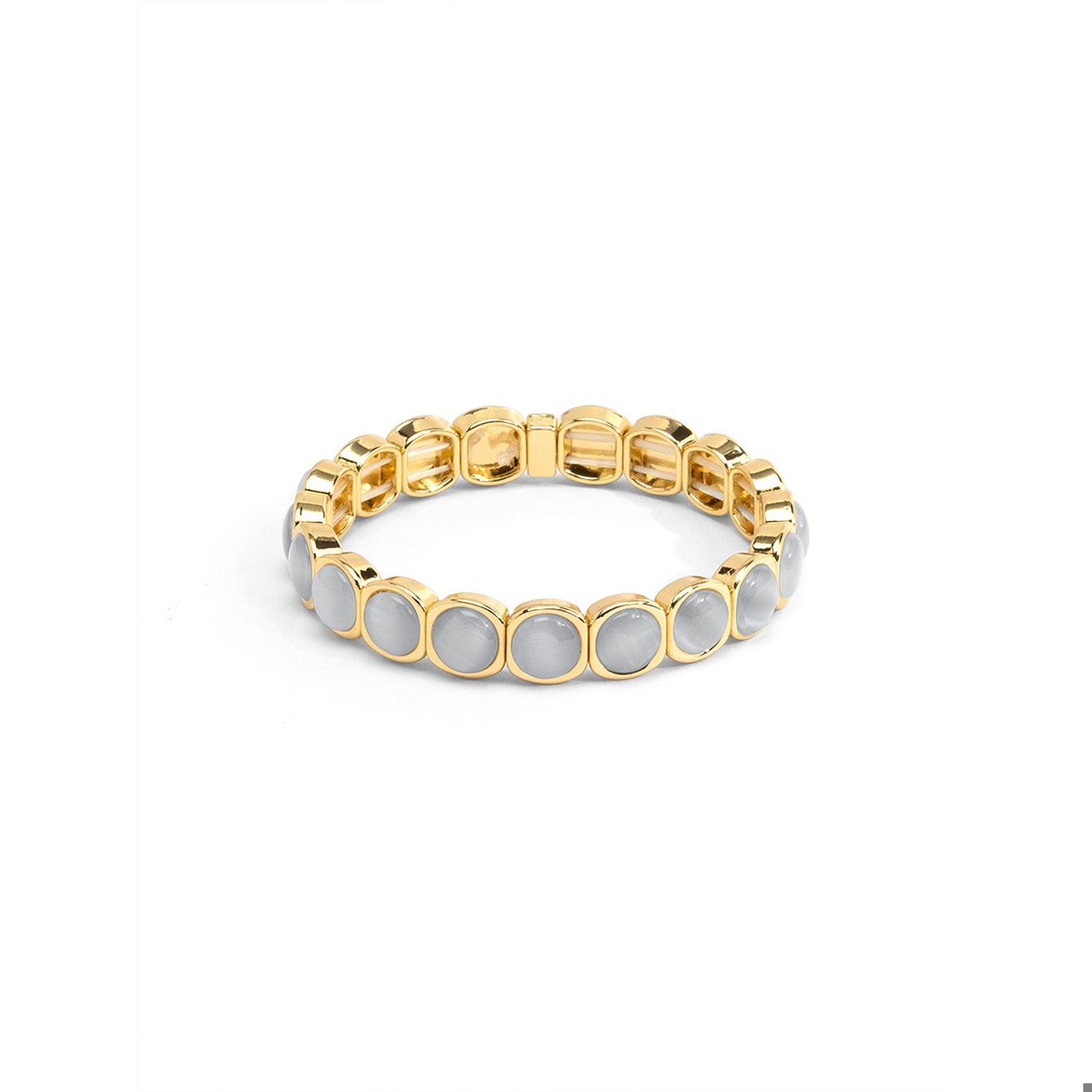 A gold-plated stretch band bracelet featuring round, light gray inlay stones.