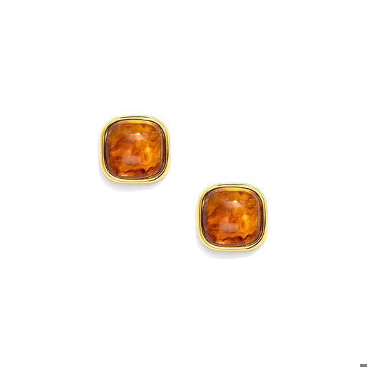 A pair of gold stud earrings with square cushion-cut amber-orange gemstones.